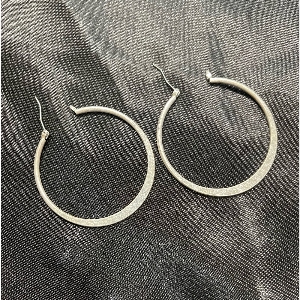 Silver tone hoops.